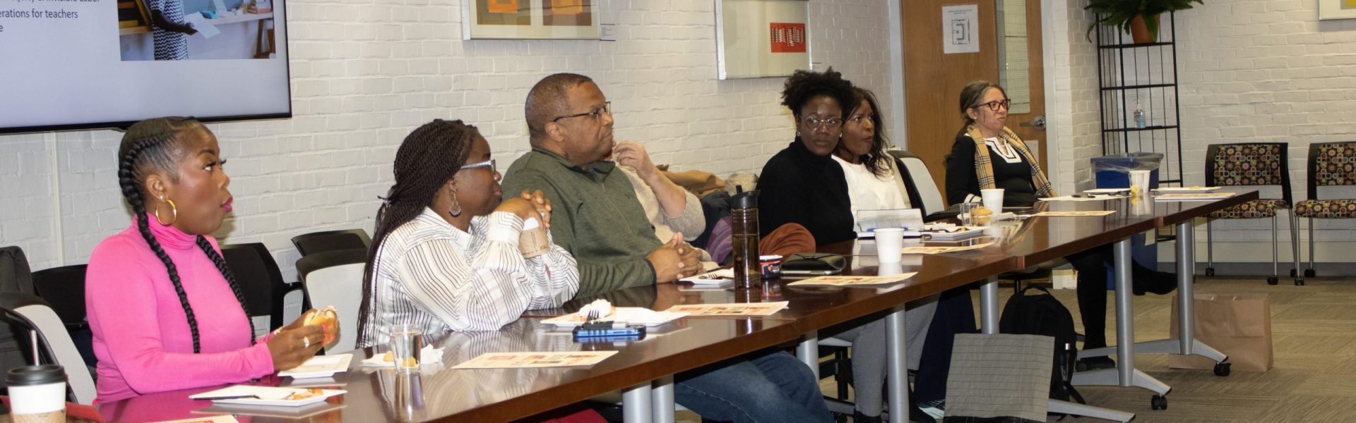 Africana Studies Department Faculty sitting together at the Be Well Workshop