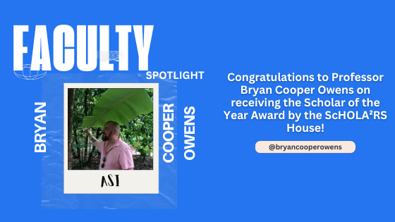 Faculty spotlight on a blue background featuring a man with a beard and a pink shirt holding a large leaf in a forest. Text congratulates him as Scholar of the Year.