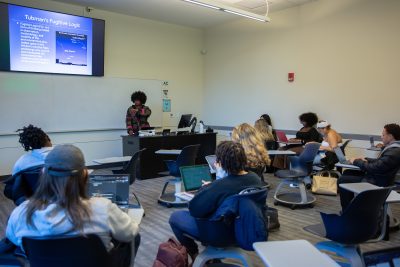 Deirdre Cooper Owens, associate professor of history and Africana studies, teaches a section of AFRA 3206: Black Experience in the Americas in Herbst Hall on Nov. 19, 2024. (Bri Diaz/UConn Photo)