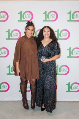 Dr. Burnett receives an award from SHE WORKS for mentorship