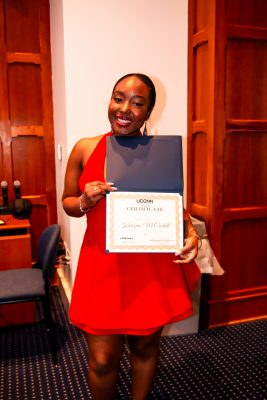Karizma McCardell holding certificate