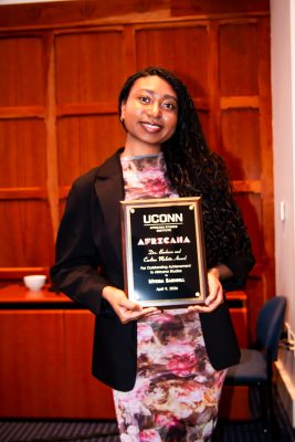 Myeisa Barnhill holding Molette Award
